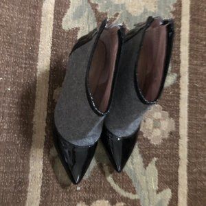 ince Camuto grey wool with black patent trim.